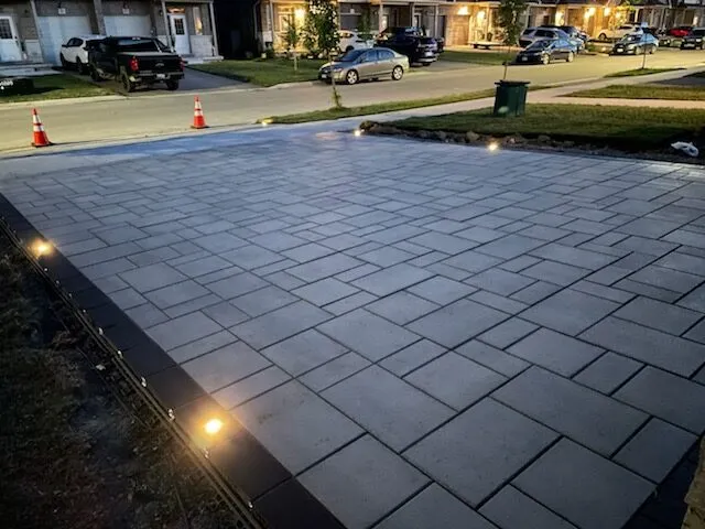Completed Binbrook front entrance and driveway interlock with lighting after installation.