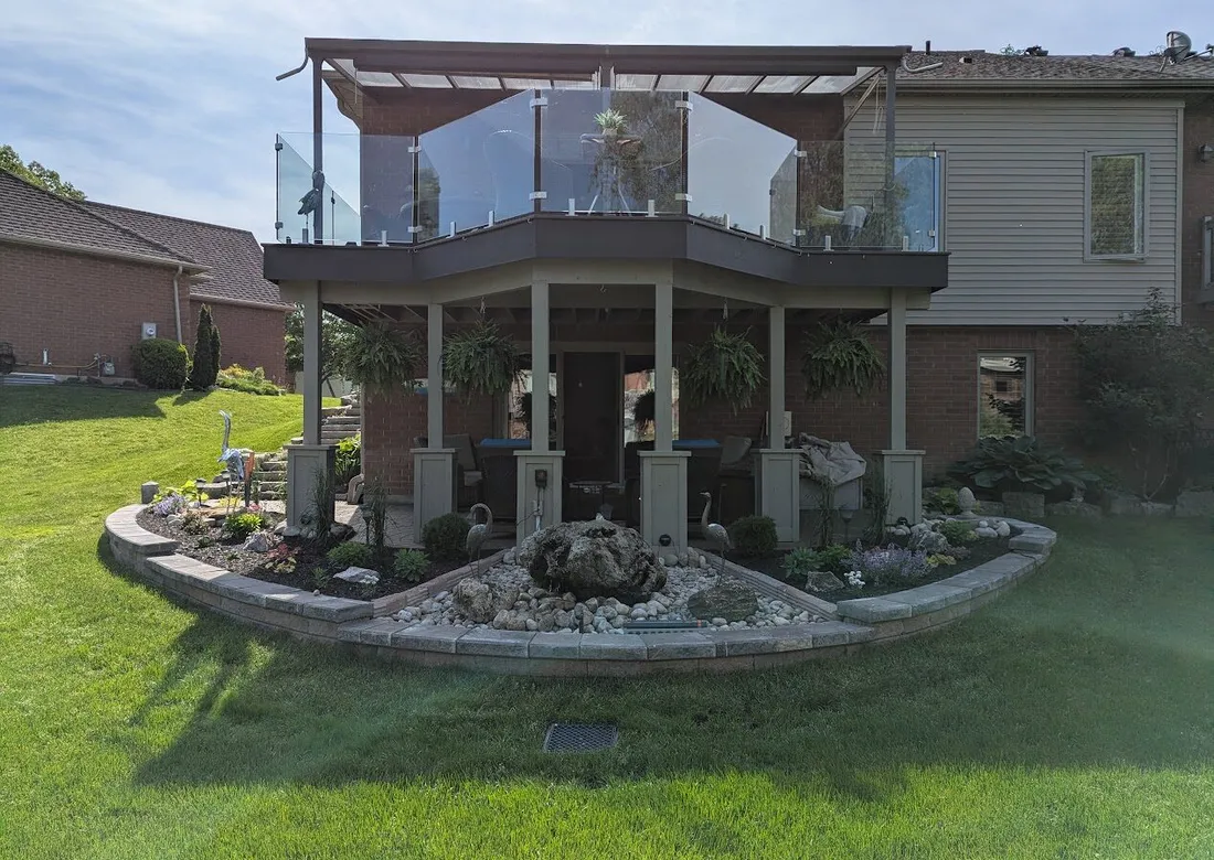 A backyard curved garden wall system with 3 clear sections