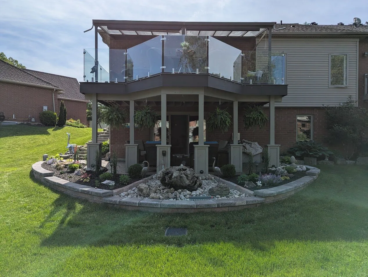 A backyard curved garden wall system with 3 clear sections