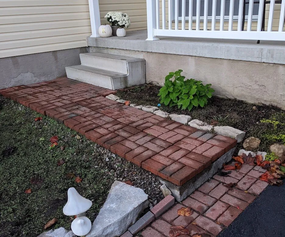 A crudely installed front landing with numerous uneven steps