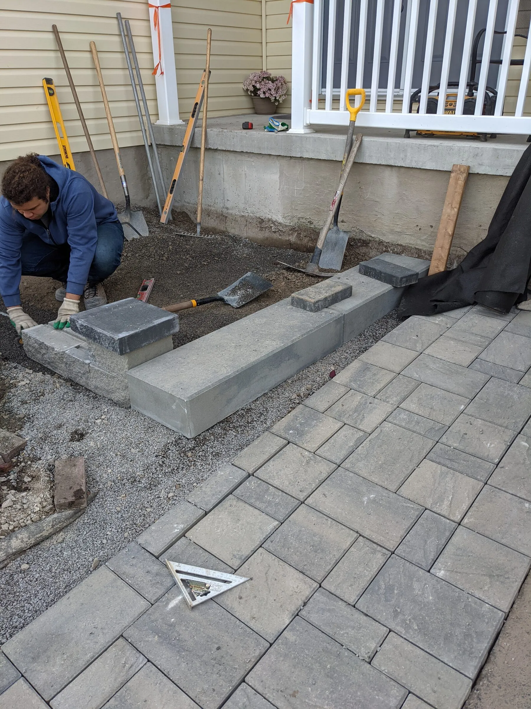 Hardscaping crew working carefully on a clean residential job site