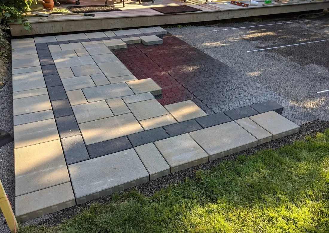 An interlock patio being installed on panels