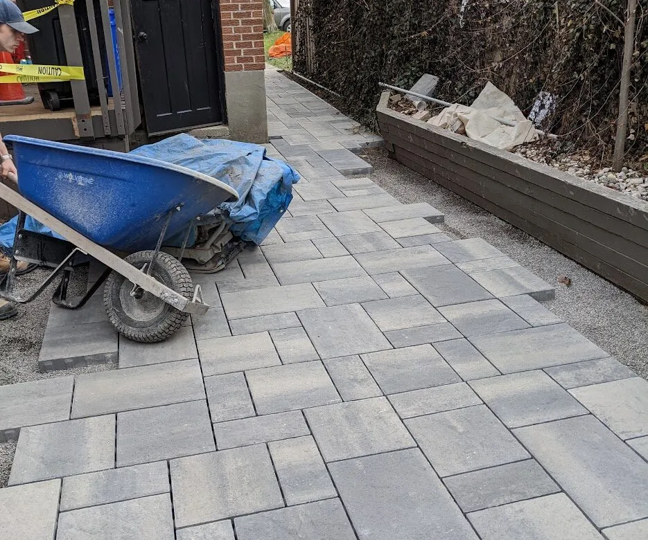 Interlock installation for a walkway and patio for the side of a house