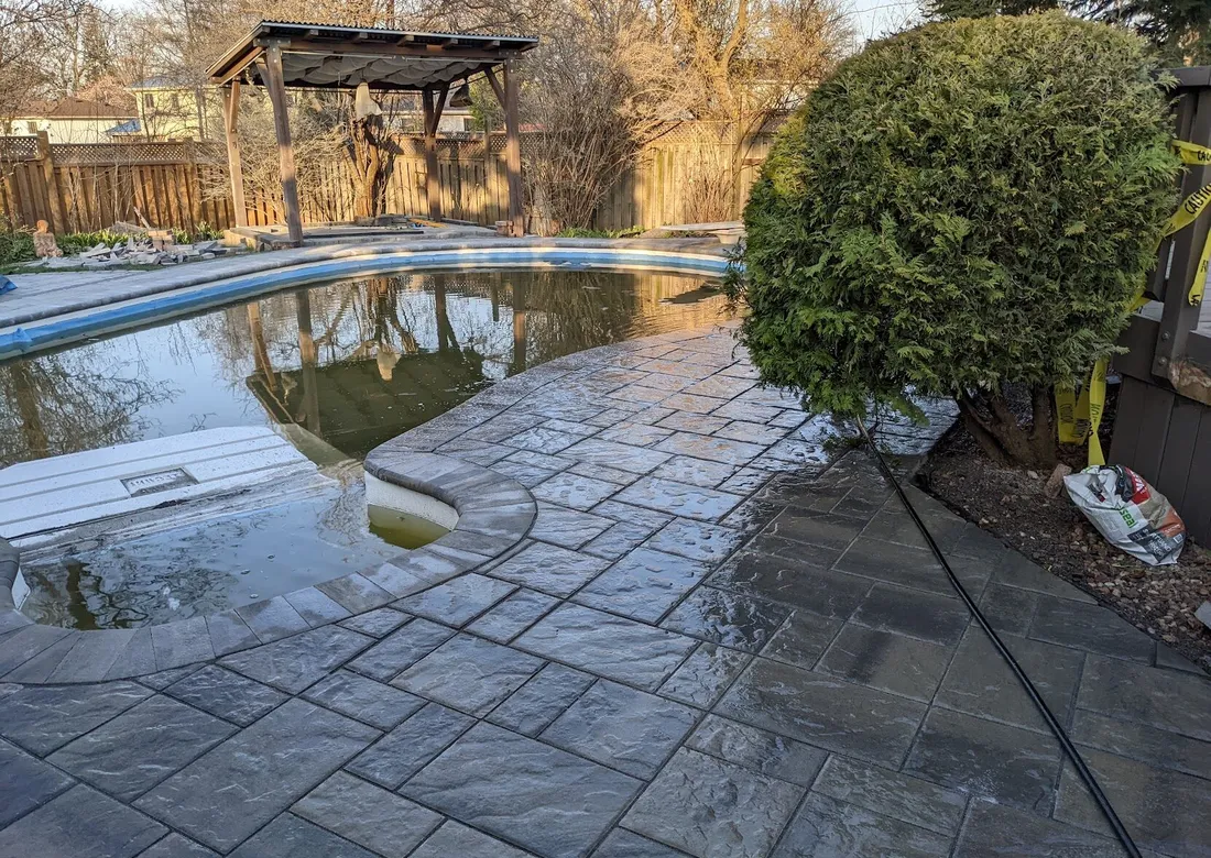 Interlock installation for a walkway and patio for the side of a house