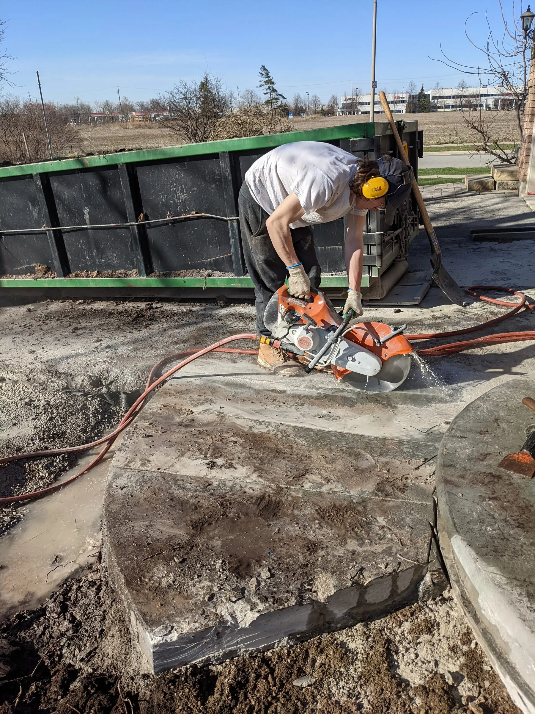 Hardscaping crew working on an active residential job site